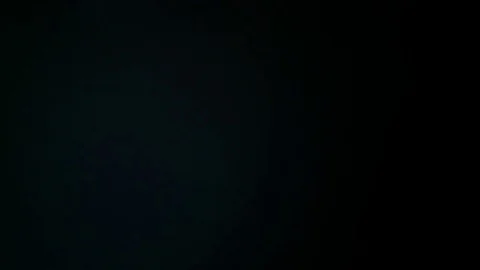 Light leak in 4K quality on dark background with.Real lens flare Stock Footage 81402690