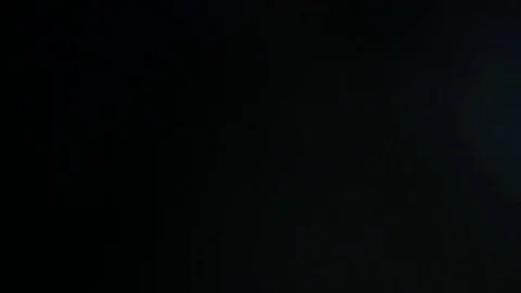 Light leak in 4K quality on dark background with.Real lens flare Stock Footage 81409029