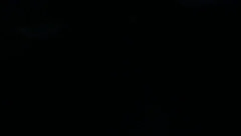 Light leak in 4K quality on dark background with.Real lens flare Stock Footage 81409859