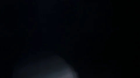 Light leak in 4K quality on dark background with.Real lens flare Stock Footage 81409906