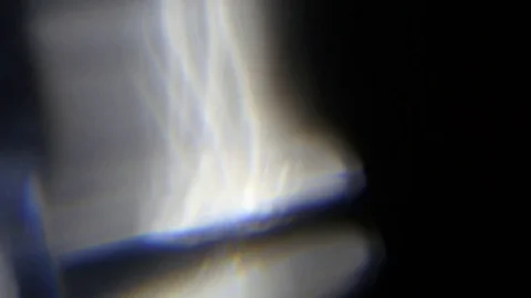 Light leak in 4K quality on dark background with.Real lens flare Stock Footage 81411004
