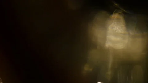 Light leak in 4K quality on dark background with.Real lens flare Stock Footage 83245566