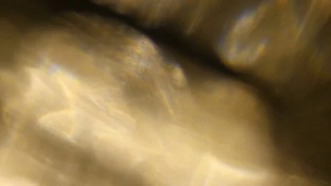 Light leak in 4K quality on dark background with.Real lens flare Stock Footage 83257174