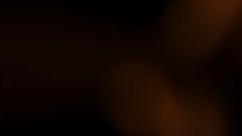 Light leak in 4K quality on dark background with.Real lens flare Stock Footage 85355167