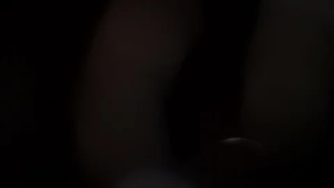 Light leak in 4K quality on dark background with.Real lens flare Video stock 86686311