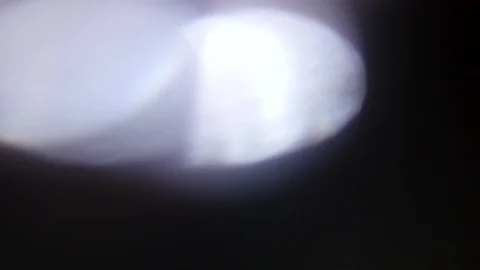 Light leak in 4K quality on dark background with.Real lens flare Stock Footage 86689406