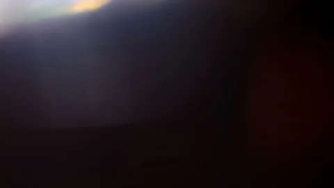 Light leak in 4K quality on dark background with.Real lens flare Stock Footage 86689793