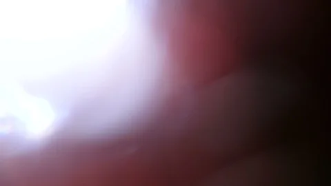 Light leak in 4K quality on dark background with.Real lens flare Stock Footage 86693289