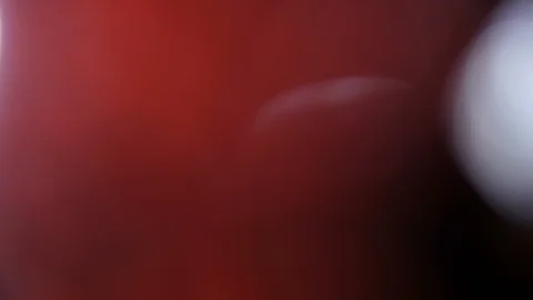 Light leak in 4K quality on dark background with.Real lens flare Stock Footage 86693567