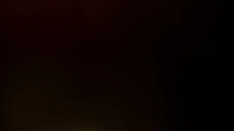Light leak in 4K quality on dark background with.Real lens flare Stock Footage 86694182