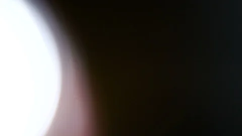 Light leak in 4K quality on dark background with.Real lens flare Stock Footage 86701859