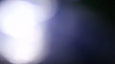 Light leak in 4K quality on dark background with.Real lens flare Stock Footage 86702240