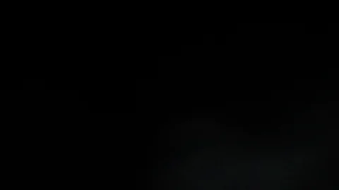 Light leak in 4K quality on dark background with.Real lens flare Stock Footage 86703983