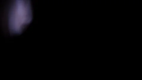 Light leak in 4K quality on dark background with.Real lens flare Stock Footage 86707330