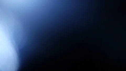 Light leak in 4K quality on dark background with.Real lens flare Stock Footage 86714136