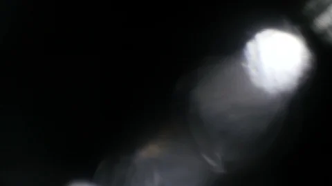 Light leak in 4K quality on dark background with.Real lens flare Stock Footage 88728732