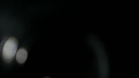 Light leak in 4K quality on dark background with.Real lens flare Stock Footage 88730309
