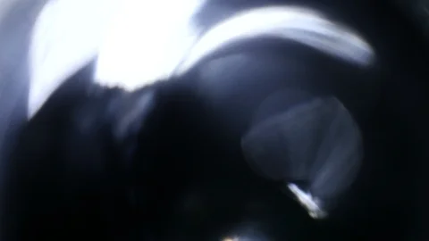 Light leak in 4K quality on dark background with.Real lens flare Stock Footage 88731529