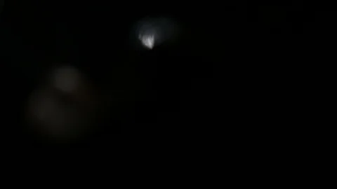 Light leak in 4K quality on dark background with.Real lens flare Stock Footage 88740990