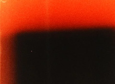 Light leak creating orange and black gradient on film frame Stockillustratie