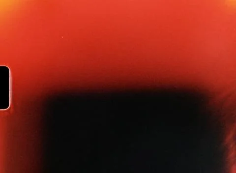Light leak creating red and black gradient on film frame edge Stock Photos