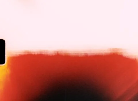 Light leak creating red gradient on damaged film material with sprocket hole Stock Photos