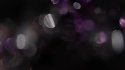 Light leak from the focus of purple and white bokeh that gives the video a look Stockbeeldmateriaal 318073348