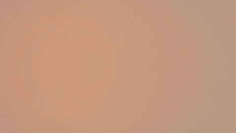 Light leak transition with warm amber glow and full frame flash Stock Footage 331573596