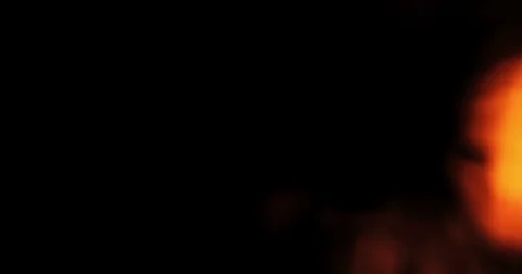 Light leak with warm light movement on black background, film transition Stock Footage 73775319