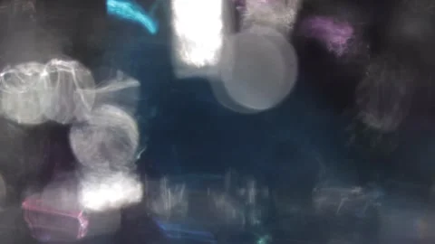 Light leakage from the focusable multi-colored bokeh that gives the video a look Vídeo Stock 317541473