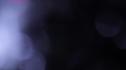 Light leaks in the background in the form of flashing multi-colored bokeh Stock Footage 318834847