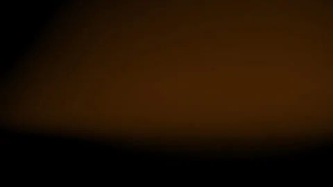 Light leaks. Horizontal blurring rays of amber light. Flickering and flashes of Stock Footage 250110485