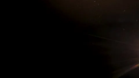 Light leaks overlay effect dark background, warm light leaks and subtle dus.. Stock Footage 346559669