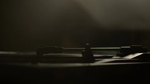 Light leaks reflects on stylus needle playing vinyl record Stock Footage 129587337