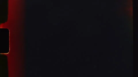 Light leaks transitioning on black background film frame Stock Footage 312993524