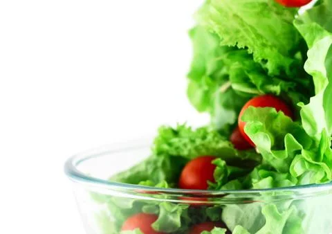 Light lettuce and tomatoes flying salad concept Stock Photos