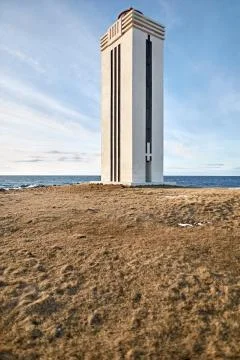 Light lighthouse on promontory Stock-Fotos