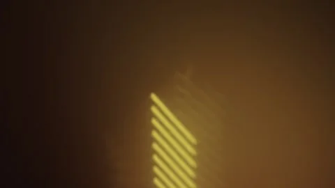 Light lines gradually disappearing on dark background Stock Footage 306581709