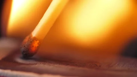 Light a match in the dark. Strike a matchstick Stock Footage 196353952