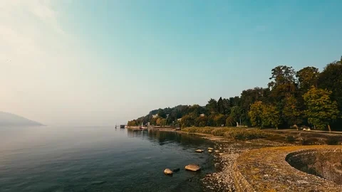 Light Mist Drifting Above Still Lake at Dawn Stock Footage 327057769