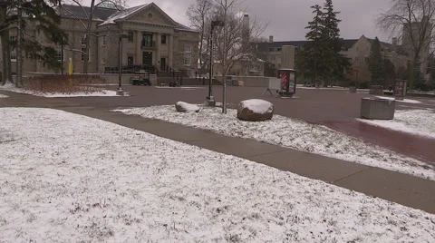 Light to moderate pretty snow and windy in the the city on cold winter day. Stock Footage 44571884