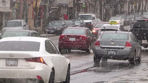 Light to moderate pretty snow and windy in the the city on cold winter day. Stock Footage 45172401