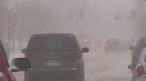 Light to moderate pretty snow and windy in the the city on cold winter day. Stock Footage 45634861