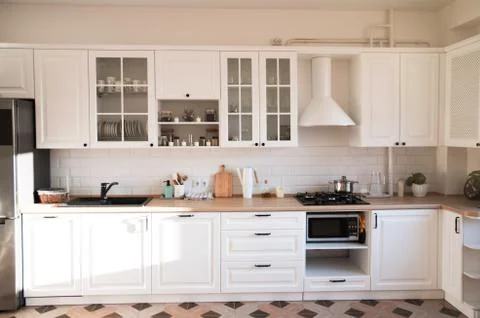Light modern kitchen in cozy house. Stock Photos