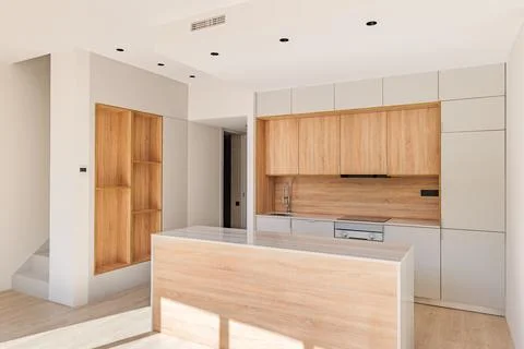 Light modular kitchen with cupboard design interior, made in white and light Photos