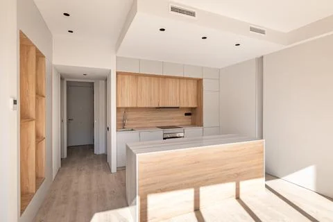 Light modular kitchen with cupboard design interior, made in white and light Фото