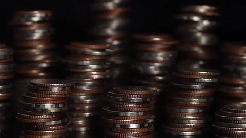 Light in motion. Play of light and shadow. different types of coins stacked Stock Footage 169208991