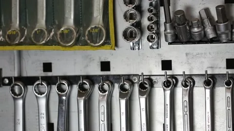 Light moves and leaves a shadow on wrenches Stock-Footage 59596087