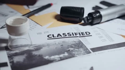 Light moving from dark to bright showing classified document on office desk Stock Footage 199974747