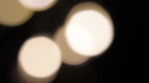 Light moving out of focus in the dark Stockbeeldmateriaal 317485515